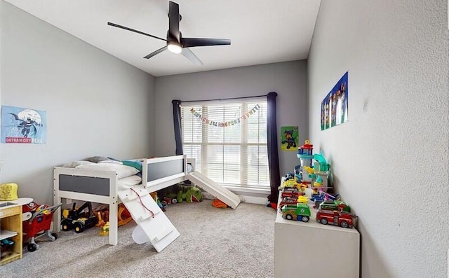 carpeted bedroom featuring ceiling fan