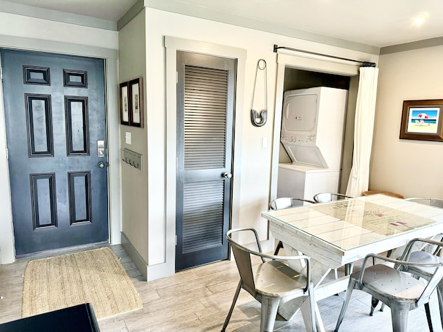 dining area with stacked washer / drying machine