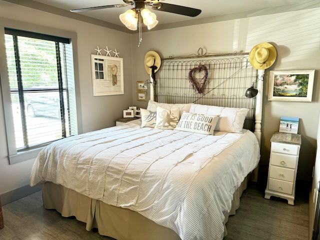 bedroom featuring ceiling fan and dark hardwood / wood-style flooring