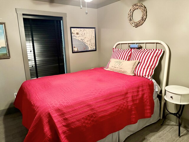 bedroom with wood-type flooring