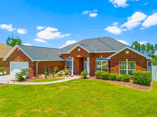 ranch-style house featuring a front lawn and a garage