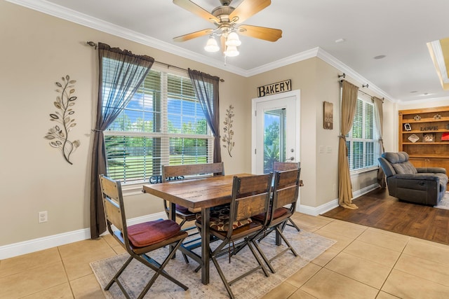 dining area with light tile patterned floors, built in features, ceiling fan, and crown molding