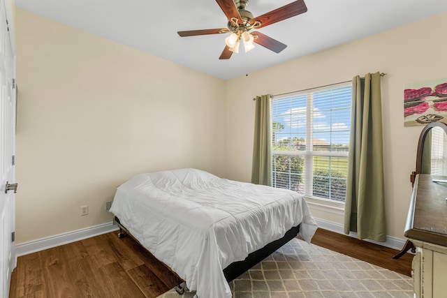 bedroom featuring ceiling fan and hardwood / wood-style flooring