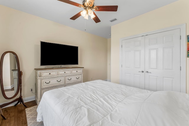 bedroom featuring ceiling fan, a closet, and wood-type flooring