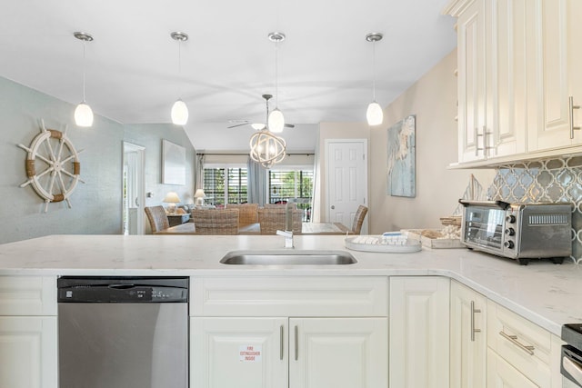 kitchen featuring sink, dishwasher, backsplash, hanging light fixtures, and light stone counters