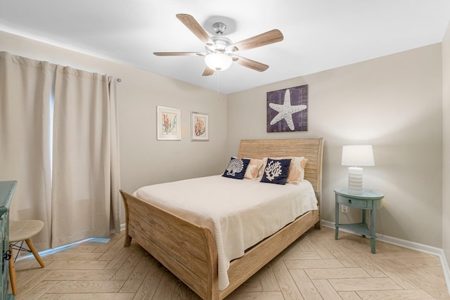 bedroom with ceiling fan and light parquet floors