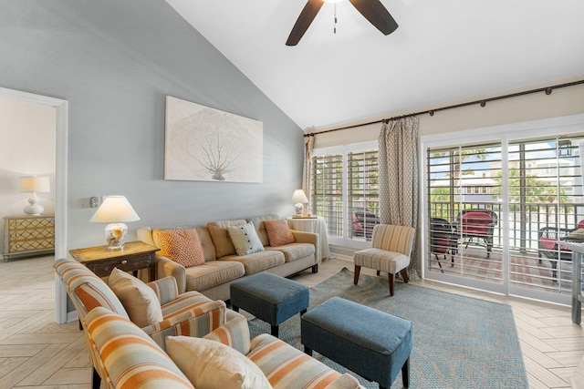 living room with light parquet floors, ceiling fan, and high vaulted ceiling