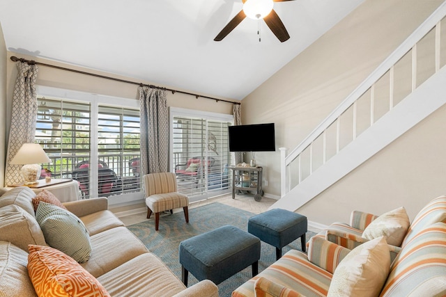 living room with ceiling fan and vaulted ceiling