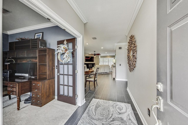 home office featuring ceiling fan and crown molding