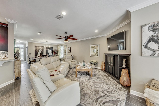 living room featuring ceiling fan and ornamental molding