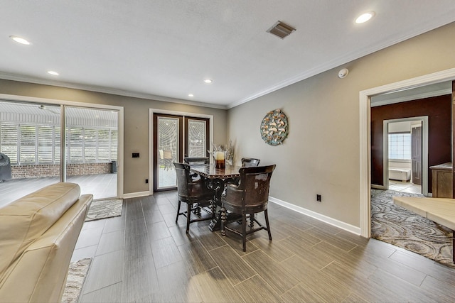 dining room featuring ornamental molding