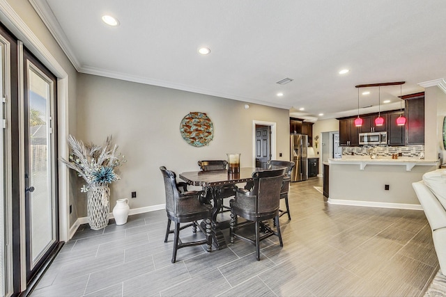 dining space with ornamental molding