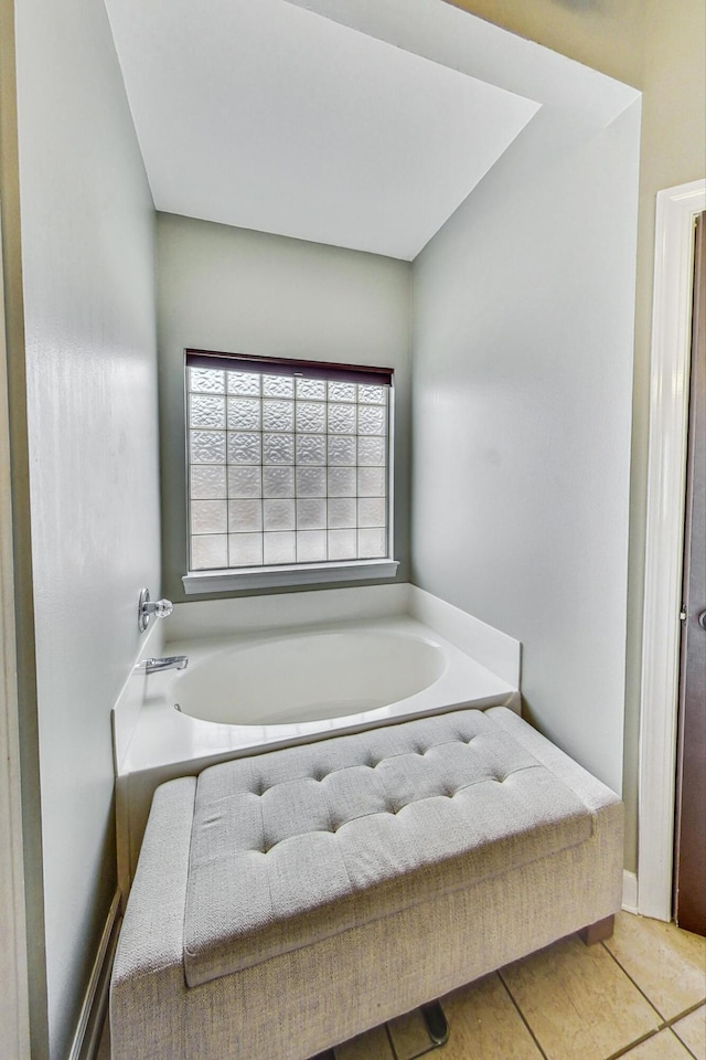 bathroom featuring a bath and tile patterned floors