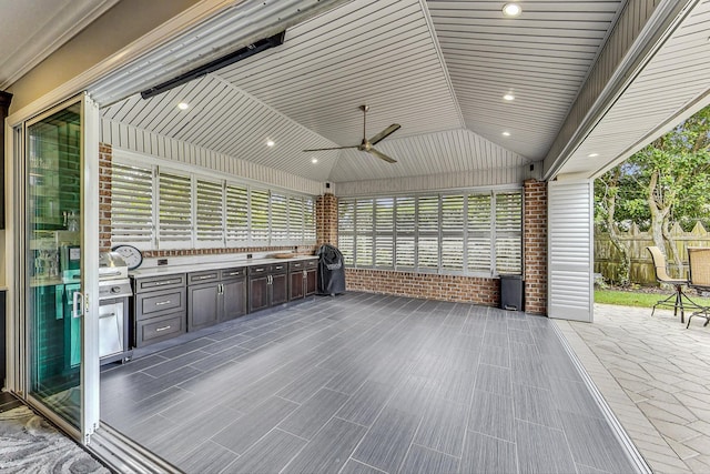 view of patio / terrace featuring area for grilling, ceiling fan, and grilling area