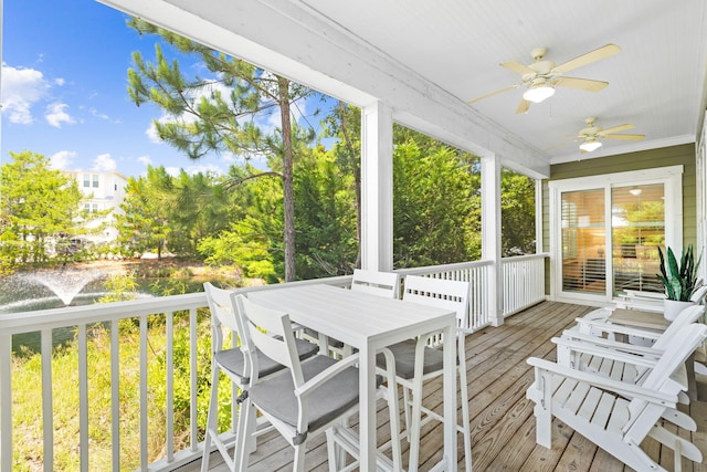 sunroom featuring ceiling fan