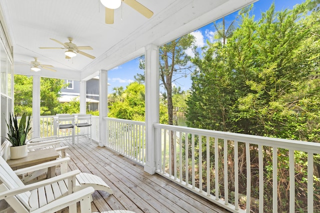 wooden deck featuring ceiling fan