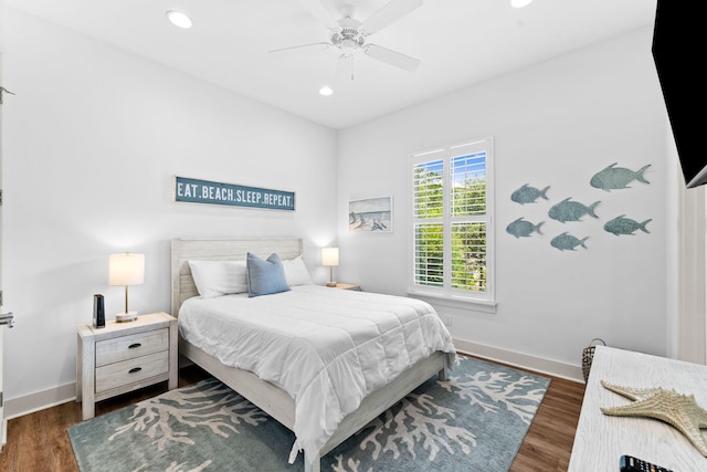 bedroom featuring ceiling fan and dark wood-type flooring