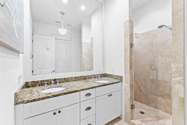 bathroom with vanity and an enclosed shower