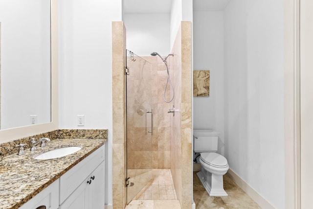 bathroom with vanity, toilet, and a shower with door