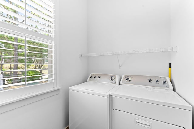 laundry area with washing machine and clothes dryer