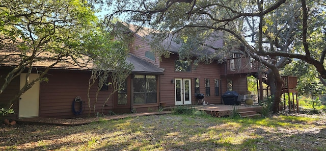 back of property featuring a deck