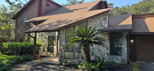 view of side of home with a garage