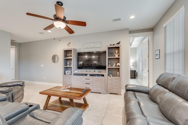 tiled living room with ceiling fan