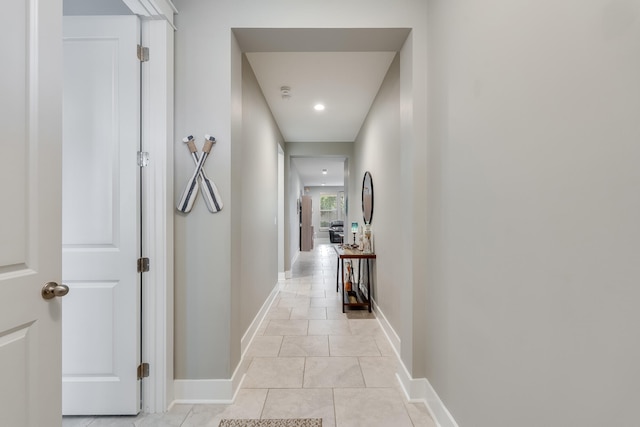 hall with light tile patterned flooring