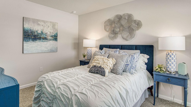 carpeted bedroom featuring baseboards