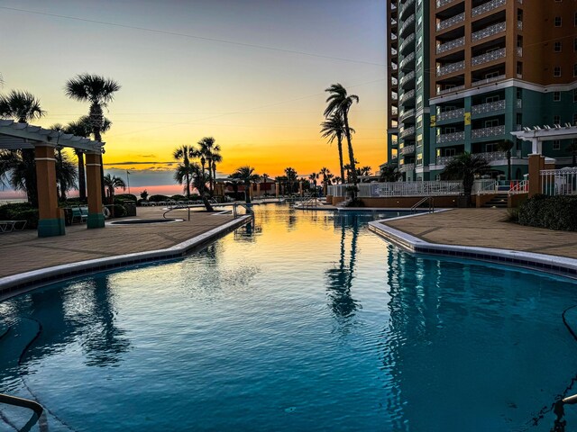 pool at dusk with a water view