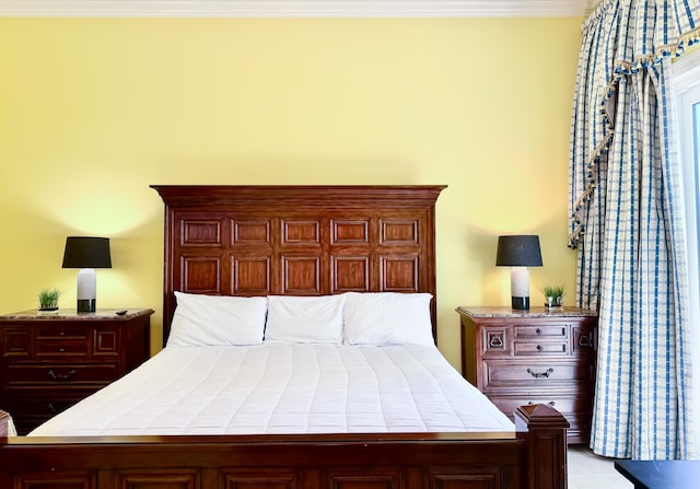 bedroom with ornamental molding