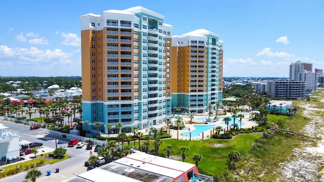 view of building exterior with a community pool