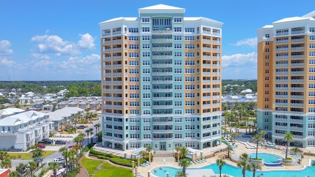 view of building exterior with a community pool