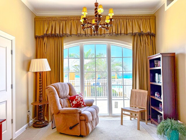 living area featuring baseboards, a chandelier, and ornamental molding