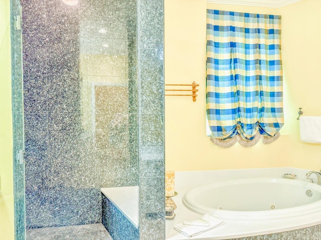 full bathroom featuring a jetted tub and ornamental molding