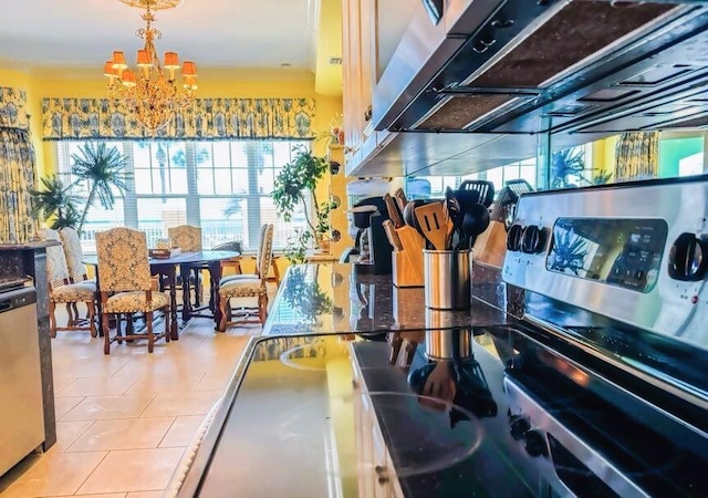 interior space with dishwasher, a chandelier, and hanging light fixtures