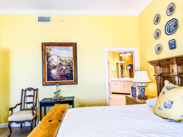 bedroom with ensuite bath, visible vents, and ornamental molding