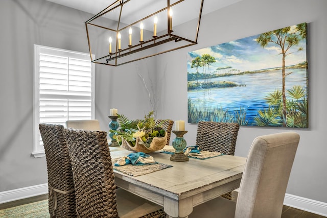 dining space with dark hardwood / wood-style flooring