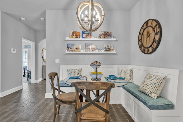 dining room featuring breakfast area and an inviting chandelier