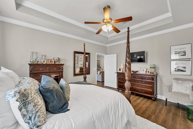 bedroom with a tray ceiling, ceiling fan, and crown molding