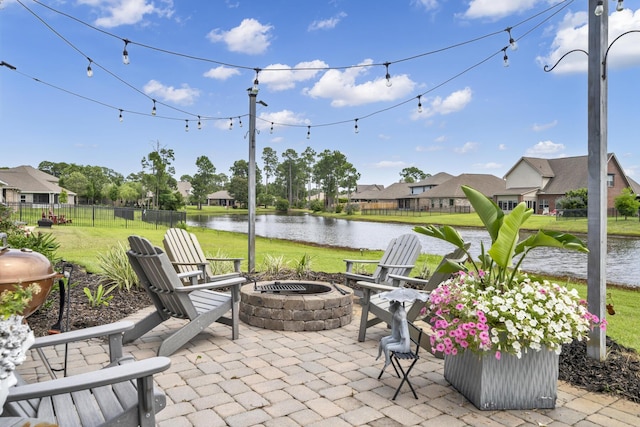 view of patio / terrace with a water view and an outdoor fire pit