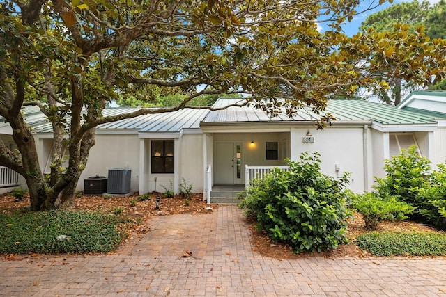 view of front of house featuring central AC and a porch