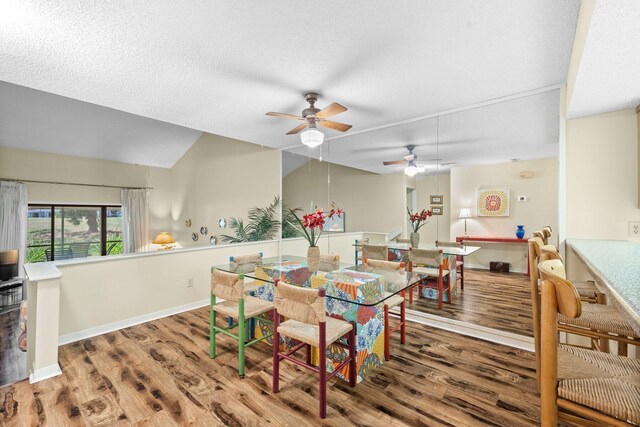 dining space featuring ceiling fan and hardwood / wood-style floors