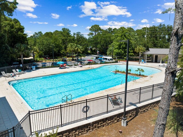 view of swimming pool featuring a patio area