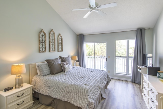 bedroom with access to exterior, a textured ceiling, light wood-type flooring, and ceiling fan