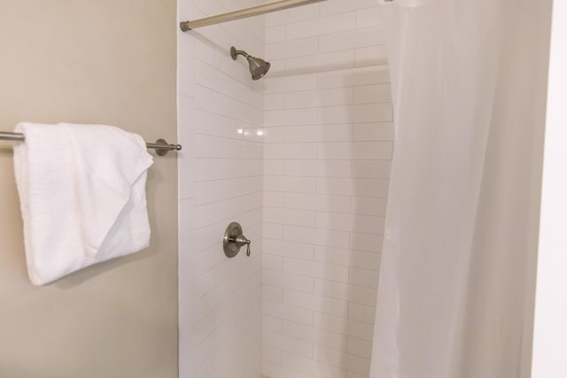 bathroom with a shower with curtain