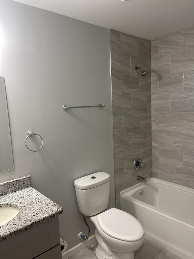 full bathroom with tile patterned floors, vanity, toilet, and tiled shower / bath