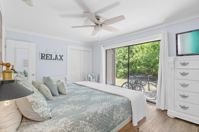 bedroom with a closet, access to exterior, ceiling fan, crown molding, and hardwood / wood-style floors