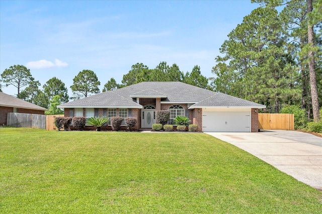 ranch-style house with a front yard and a garage