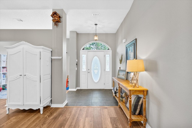 foyer entrance with dark wood-type flooring